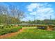 Well-maintained tennis courts surrounded by lush landscaping are perfect for a friendly match at 15307 Country Lake Dr, Pineville, NC 28134