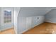 Neutral colored walls with hardwood floors and view through a window. Attic at 1919 46Th Avenue Ne Dr # 46, Hickory, NC 28601