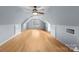 Finished attic features hardwood floors, neutral walls, lighting and a view through a window at 1919 46Th Avenue Ne Dr # 46, Hickory, NC 28601