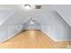 Spacious attic room with hardwood floors, neutral walls, dormer window, ceiling fan and storage at 1919 46Th Avenue Ne Dr # 46, Hickory, NC 28601