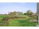 Large backyard with stone wall, wooden fence, and patio with pergola at 1919 46Th Avenue Ne Dr # 46, Hickory, NC 28601