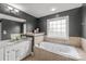 This bathroom features a soaking tub and neutral tile at 1919 46Th Avenue Ne Dr # 46, Hickory, NC 28601