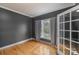 Cozy bedroom with hardwood floors, neutral walls, soft lighting, and a window with light-filtering curtains at 1919 46Th Avenue Ne Dr # 46, Hickory, NC 28601