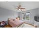 Cozy bedroom with hardwood floors, a ceiling fan, and a bright window with natural light at 1919 46Th Avenue Ne Dr # 46, Hickory, NC 28601