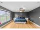 Spacious bedroom featuring hardwood floors, a ceiling fan, and natural light from the window at 1919 46Th Avenue Ne Dr # 46, Hickory, NC 28601