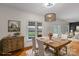 Bright dining room with light walls, hardwood floors, and a farmhouse-style table at 1919 46Th Avenue Ne Dr # 46, Hickory, NC 28601