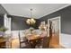 This dining room features neutral walls, hardwood floors, and a wooden table with seating for six at 1919 46Th Avenue Ne Dr # 46, Hickory, NC 28601