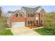 Beautiful brick two-story home with an attached garage and lush green lawn at 1919 46Th Avenue Ne Dr # 46, Hickory, NC 28601