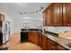 Well-equipped kitchen with dark granite countertops, modern appliances, and warm wood cabinetry at 1919 46Th Avenue Ne Dr # 46, Hickory, NC 28601