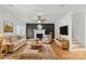 Cozy living room with fireplace, hardwood floors, and comfortable seating arrangement at 1919 46Th Avenue Ne Dr # 46, Hickory, NC 28601