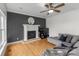 The living room boasts a fireplace, ceiling fan, and hardwood flooring, providing a warm and inviting space at 1919 46Th Avenue Ne Dr # 46, Hickory, NC 28601