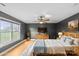 Tranquil main bedroom with a ceiling fan, large window, and hardwood floors at 1919 46Th Avenue Ne Dr # 46, Hickory, NC 28601