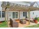 Inviting outdoor patio with stylish wicker furniture and a pergola at 1919 46Th Avenue Ne Dr # 46, Hickory, NC 28601