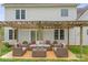 Inviting outdoor patio with stylish wicker furniture and a pergola at 1919 46Th Avenue Ne Dr # 46, Hickory, NC 28601