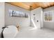 Modern bathroom with tub, shower, and large horizontal window offering private outdoor view at 2010 Bessbrook Rd, Fort Mill, SC 29708