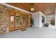 Inviting front porch with a stone accent wall, double doors, and stylish décor at 2010 Bessbrook Rd, Fort Mill, SC 29708