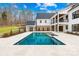 Backyard featuring swimming pool and well manicured lawn and back porch at 2010 Bessbrook Rd, Fort Mill, SC 29708