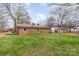 Expansive backyard featuring a well-maintained lawn and brick exterior of the home at 209 Palmer St, Shelby, NC 28150