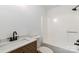 Clean bathroom features wood vanity with marble countertop, toilet, and shower at 209 Palmer St, Shelby, NC 28150