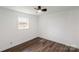 Bedroom features hardwood floors, white walls, and natural light at 209 Palmer St, Shelby, NC 28150