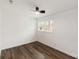 Bedroom features hardwood floors, white walls, and a ceiling fan at 209 Palmer St, Shelby, NC 28150