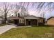 Charming brick home featuring a carport and well-maintained lawn at 209 Palmer St, Shelby, NC 28150