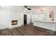 Bright living room features hardwood floors, fireplace, and modern ceiling fan at 209 Palmer St, Shelby, NC 28150