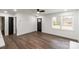 Bright living room features hardwood floors, large windows, and ceiling fan at 209 Palmer St, Shelby, NC 28150