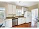 Bright kitchen featuring stainless appliances and ample counter space next to large window with natural light at 21114 Bethel Church Rd, Cornelius, NC 28031