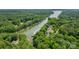 Stunning aerial view of a lakeside community with lush greenery and private docks along the tranquil waterway at 228 Wildwood Cove Dr, Mooresville, NC 28117