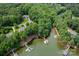 Gorgeous aerial view of the lakefront property, surrounded by lush greenery and with private dock access at 228 Wildwood Cove Dr, Mooresville, NC 28117