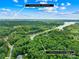Breathtaking aerial view of property with lush greenery and serene waterfront access at 228 Wildwood Cove Dr, Mooresville, NC 28117