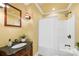 Bathroom with wood vanity, granite countertop, and shower with tub at 228 Wildwood Cove Dr, Mooresville, NC 28117