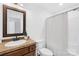 Bathroom features a shower/tub combination and a vanity with tile countertops at 228 Wildwood Cove Dr, Mooresville, NC 28117