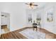 Bedroom with wood floors, ceiling fan, rug, and a bay window nook perfect for a desk at 228 Wildwood Cove Dr, Mooresville, NC 28117