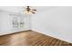 Bright bedroom with wood floors, white walls, and a window providing natural light at 228 Wildwood Cove Dr, Mooresville, NC 28117