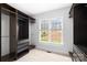 Spacious walk-in closet with custom shelving and storage solutions and a window at 228 Wildwood Cove Dr, Mooresville, NC 28117