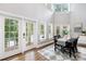 Elegant dining room with natural light, beautiful windows, and french doors at 228 Wildwood Cove Dr, Mooresville, NC 28117