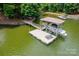 Beautiful view of the private dock, boat lift, and lake access, perfect for water sports enthusiasts at 228 Wildwood Cove Dr, Mooresville, NC 28117