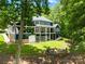 Large backyard with multi-tiered deck, hot tub, and stone patio at 228 Wildwood Cove Dr, Mooresville, NC 28117