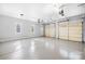 Spacious three car garage with pristine epoxy floors and plenty of natural light at 228 Wildwood Cove Dr, Mooresville, NC 28117
