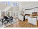 Eat-in kitchen area with black table set, lots of natural light and seamless transition to the kitchen at 228 Wildwood Cove Dr, Mooresville, NC 28117