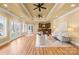 Open living room with wood floors, recessed lighting, access to a bar area, and French doors at 228 Wildwood Cove Dr, Mooresville, NC 28117