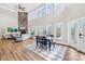 Bright living room boasts soaring ceilings, stone fireplace and large windows offering tons of natural light at 228 Wildwood Cove Dr, Mooresville, NC 28117