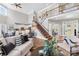 Spacious living room with high ceilings, a staircase, and access to other rooms at 228 Wildwood Cove Dr, Mooresville, NC 28117