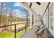 Covered outdoor porch features plenty of seating, outdoor ceiling fans and lake views at 228 Wildwood Cove Dr, Mooresville, NC 28117