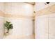 Close up of walk-in shower with neutral tile and a decorative tile border at 228 Wildwood Cove Dr, Mooresville, NC 28117