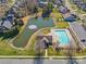 Aerial view of community pool and pond, showcasing the recreational amenities available to residents at 2464 Chatham Dr, Indian Land, SC 29707