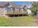 Expansive backyard featuring a well-kept lawn and glimpses of the back deck at 2464 Chatham Dr, Indian Land, SC 29707
