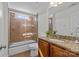 Bathroom featuring granite countertops, single sink vanity and a tub with shower at 2464 Chatham Dr, Indian Land, SC 29707